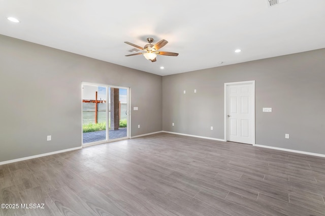 3000 S Smokin Pistol Way, Tucson, AZ 85713 - empty room with ceiling fan, baseboards, wood finished floors, and recessed lighting