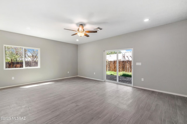3000 S Smokin Pistol Way, Tucson, AZ 85713 - unfurnished room featuring a ceiling fan, baseboards, wood finished floors, and recessed lighting