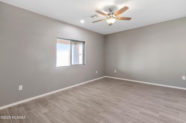 3000 S Smokin Pistol Way, Tucson, AZ 85713 - empty room with a ceiling fan, baseboards, light wood finished floors, and recessed lighting