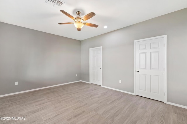 3000 S Smokin Pistol Way, Tucson, AZ 85713 - unfurnished bedroom featuring light wood-type flooring, baseboards, recessed lighting, and ceiling fan