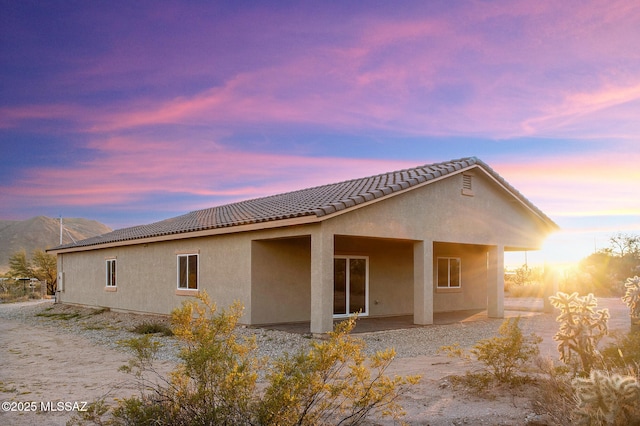 3000 S Smokin Pistol Way, Tucson, AZ 85713 - rear view of house with stucco siding, a tile roof, and a patio