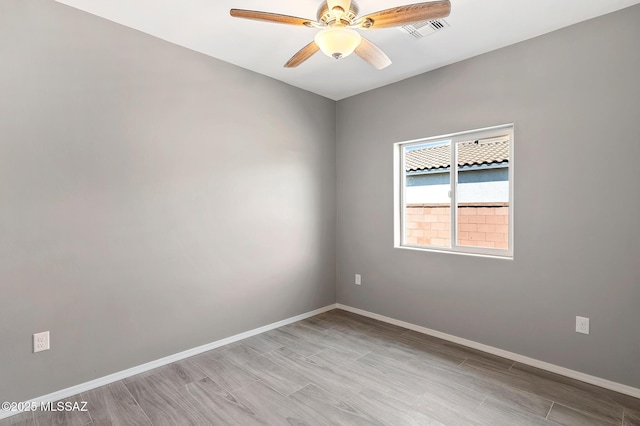 3000 S Smokin Pistol Way, Tucson, AZ 85713 - spare room featuring ceiling fan, baseboards, and light wood-style flooring