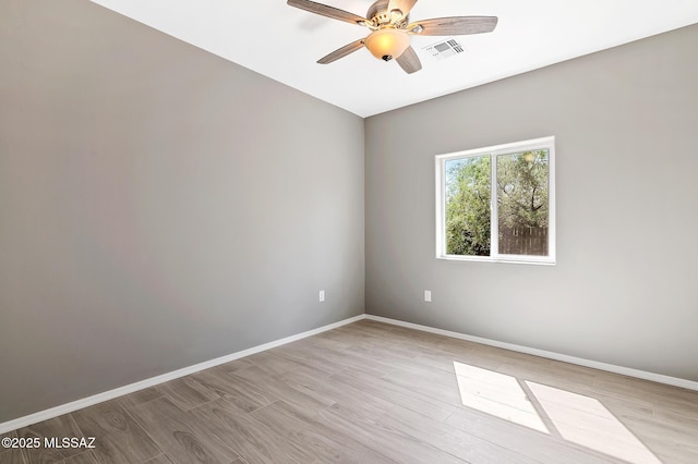 3000 S Smokin Pistol Way, Tucson, AZ 85713 - empty room featuring baseboards, a ceiling fan, and wood finished floors