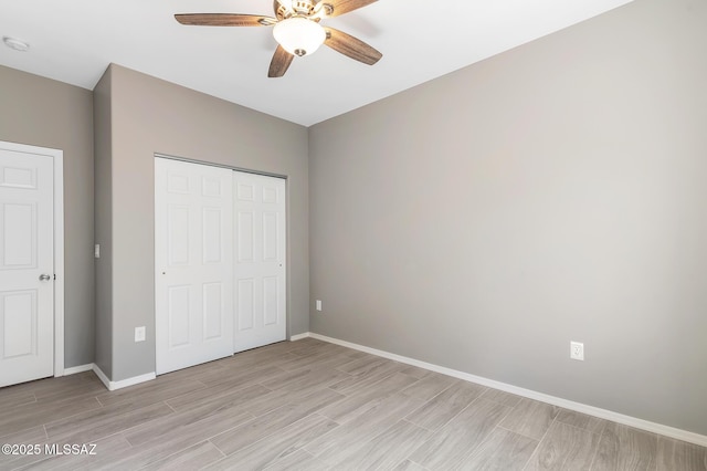 3000 S Smokin Pistol Way, Tucson, AZ 85713 - unfurnished bedroom featuring light wood-style flooring, a closet, baseboards, and ceiling fan
