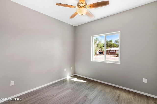 3000 S Smokin Pistol Way, Tucson, AZ 85713 - empty room with baseboards, wood finished floors, and ceiling fan