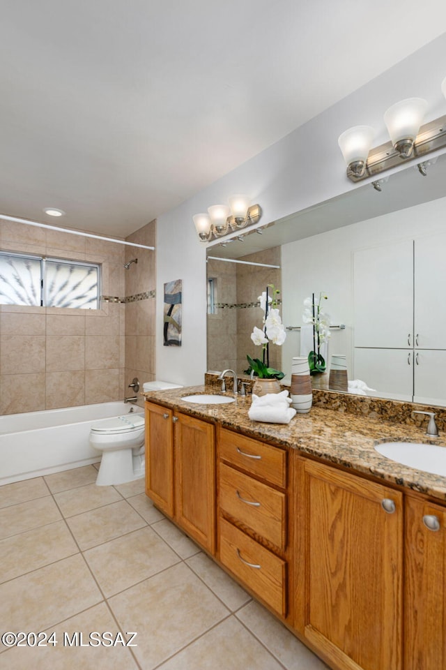 full bathroom with tile patterned floors, double vanity,  shower combination, and toilet