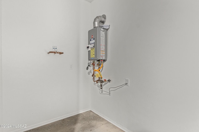 utility room featuring water heater