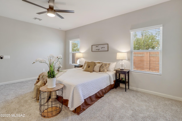 bedroom with carpet, visible vents, a ceiling fan, and baseboards