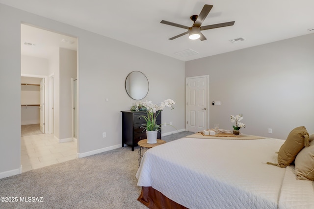 carpeted bedroom featuring visible vents, ceiling fan, and baseboards