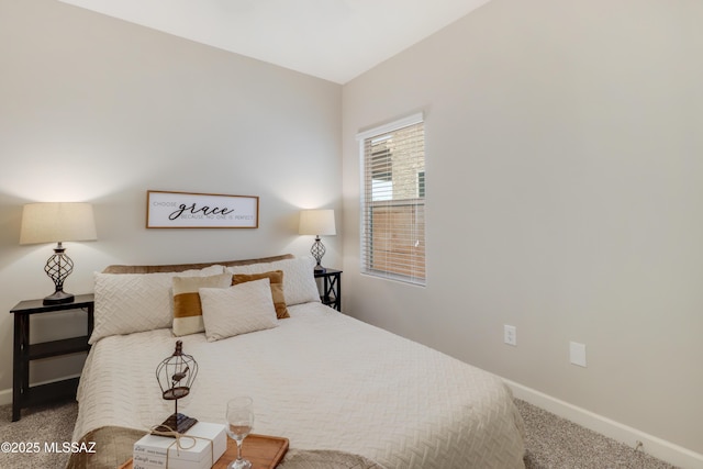 bedroom featuring baseboards and carpet floors