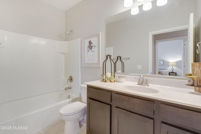 full bathroom featuring toilet, tile patterned flooring,  shower combination, and vanity
