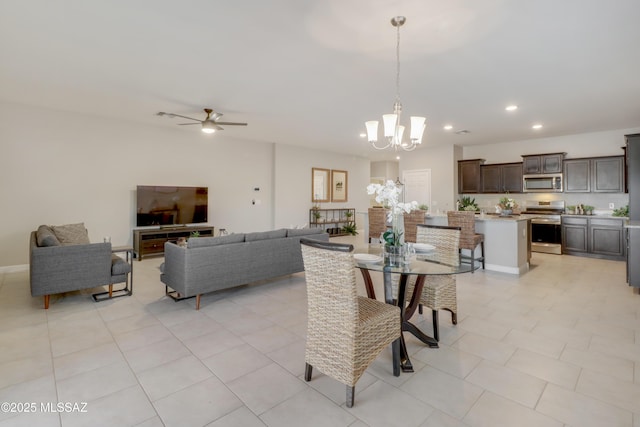 dining area with recessed lighting and ceiling fan with notable chandelier