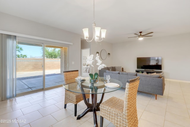 dining room featuring light tile patterned flooring and ceiling fan with notable chandelier