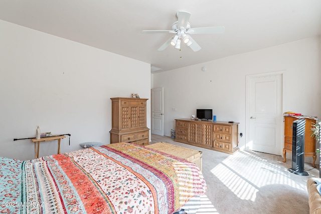 bedroom with a ceiling fan and light colored carpet