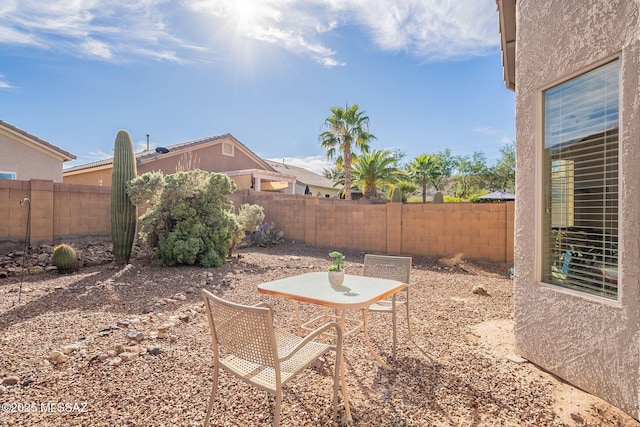 view of yard featuring a patio and a fenced backyard