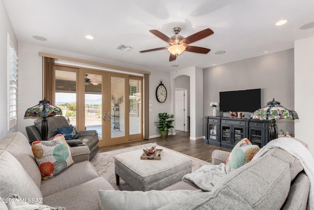 6505 W Sugar Pine Trl, Tucson, AZ 85743 - living room featuring french doors, arched walkways, a ceiling fan, wood finished floors, and recessed lighting