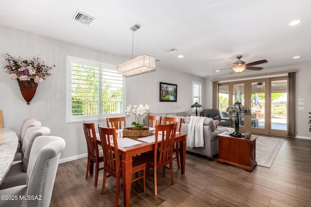 6505 W Sugar Pine Trl, Tucson, AZ 85743 - dining room featuring wood finished floors, recessed lighting, ceiling fan, baseboards, and a chandelier