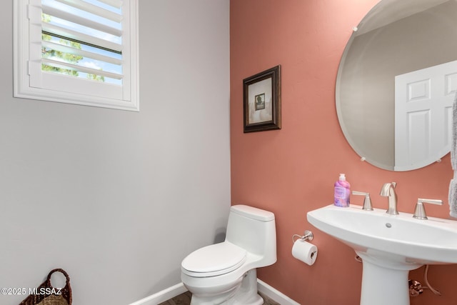 6505 W Sugar Pine Trl, Tucson, AZ 85743 - bathroom with toilet, baseboards, and a sink