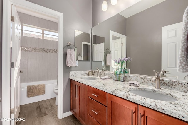6505 W Sugar Pine Trl, Tucson, AZ 85743 - full bath featuring toilet, double vanity, wood finished floors, and shower / washtub combination