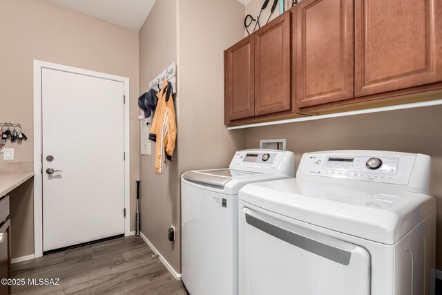 6505 W Sugar Pine Trl, Tucson, AZ 85743 - washroom with washing machine and dryer, cabinet space, light wood-style floors, and baseboards