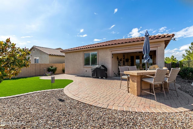 6505 W Sugar Pine Trl, Tucson, AZ 85743 - back of house featuring stucco siding, a tile roof, and a patio