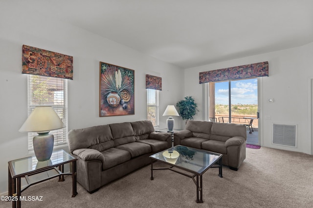 carpeted living room with visible vents