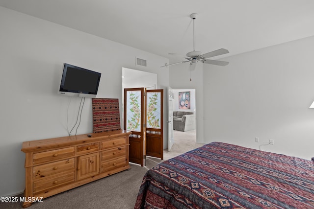 bedroom with ceiling fan, carpet floors, and visible vents