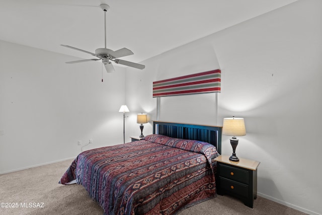 bedroom with ceiling fan, carpet, and baseboards