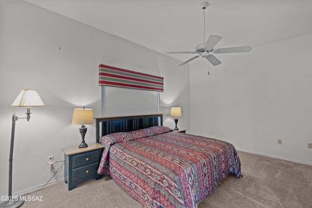 bedroom featuring baseboards, light carpet, and a ceiling fan