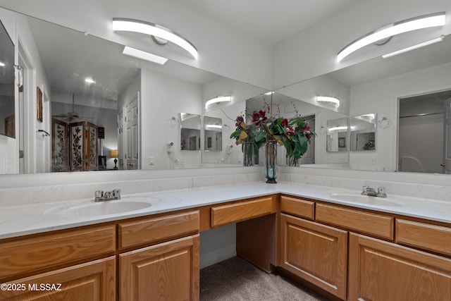 full bathroom featuring a sink and double vanity