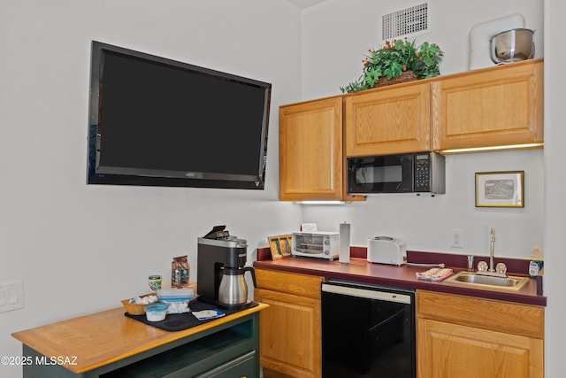 kitchen with a toaster, dishwasher, visible vents, a sink, and black microwave