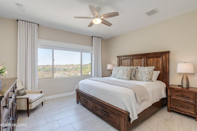 bedroom with light tile patterned floors, baseboards, a ceiling fan, and visible vents