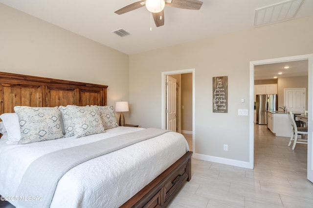 bedroom with freestanding refrigerator, a ceiling fan, baseboards, and visible vents