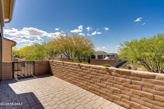 view of patio featuring fence