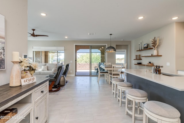 interior space featuring recessed lighting, a ceiling fan, visible vents, and light tile patterned floors