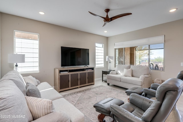 living area with recessed lighting, baseboards, and ceiling fan
