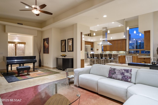 living room with baseboards, a ceiling fan, recessed lighting, and visible vents