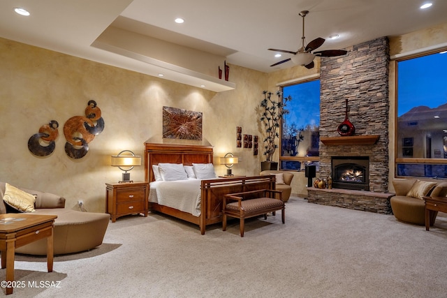 bedroom with recessed lighting, carpet flooring, and a fireplace