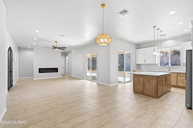 kitchen featuring visible vents, a wealth of natural light, and recessed lighting