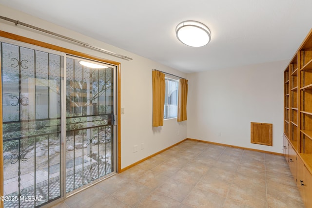 empty room with baseboards