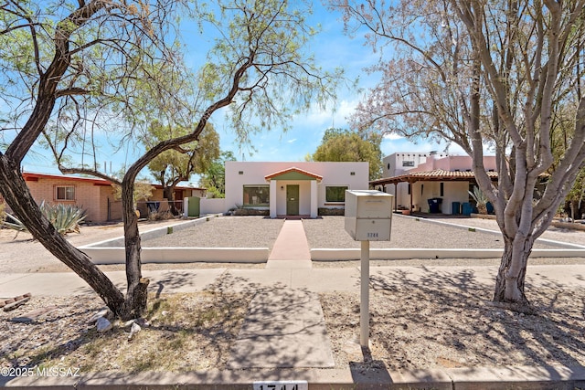 view of front of property with stucco siding and a tiled roof