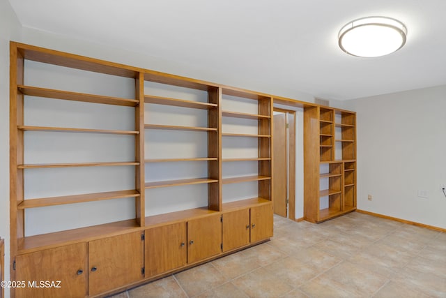 interior space featuring baseboards