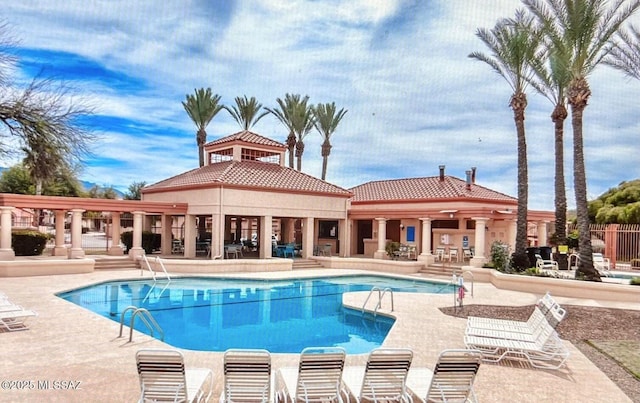 pool with a patio area