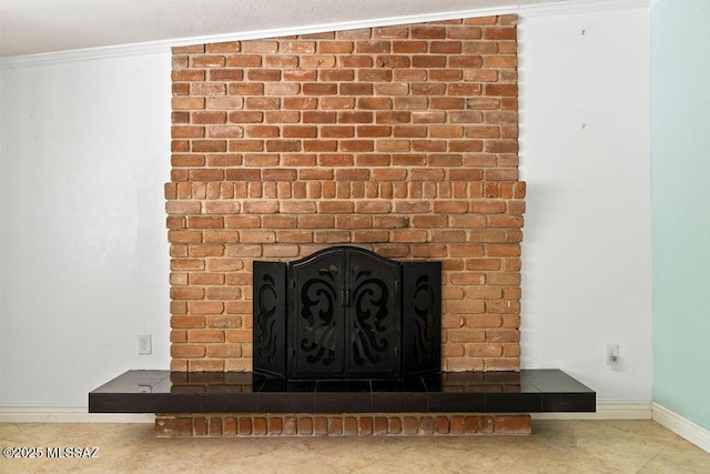room details featuring a brick fireplace, baseboards, and ornamental molding