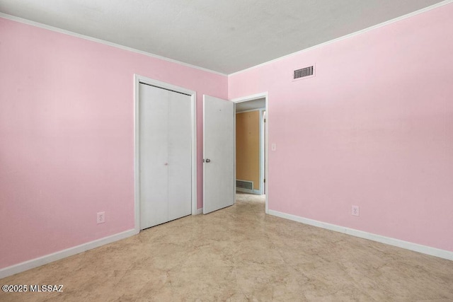 unfurnished bedroom with crown molding, baseboards, and visible vents