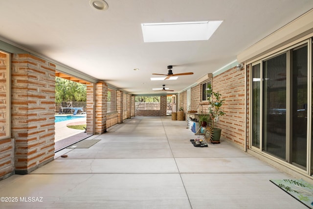 view of patio / terrace with a ceiling fan, an outdoor pool, and fence