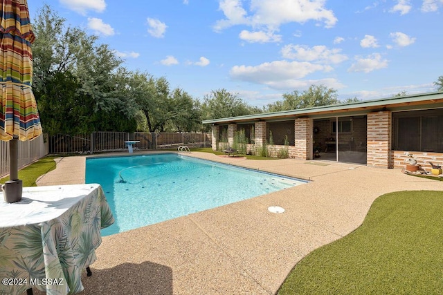view of pool featuring a fenced backyard, a fenced in pool, and a patio area