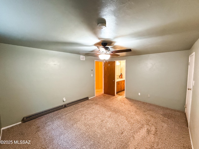 1350 E Goosetree Ln, Safford, AZ 85546 - unfurnished bedroom featuring visible vents, light carpet, baseboard heating, connected bathroom, and a ceiling fan