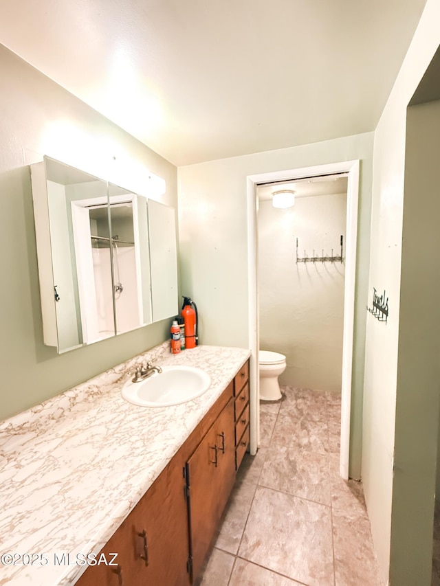 1350 E Goosetree Ln, Safford, AZ 85546 - bathroom with toilet, tile patterned flooring, and vanity