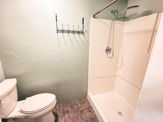 1350 E Goosetree Ln, Safford, AZ 85546 - full bath featuring a textured wall, a stall shower, and toilet